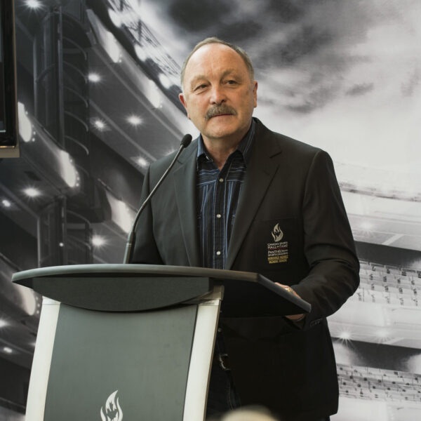 Bryan Trottier, giving a speech at a Canada's Sports Hall of Fame podium